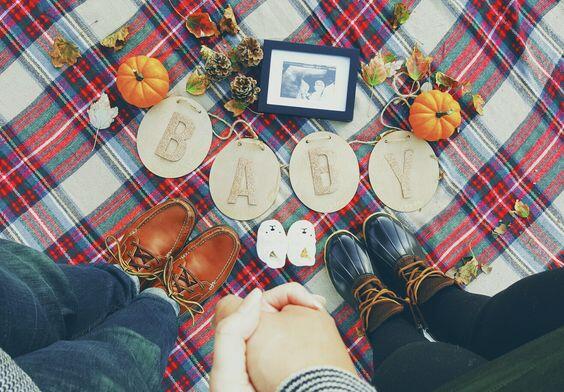 fall baby reveal with pumpkin